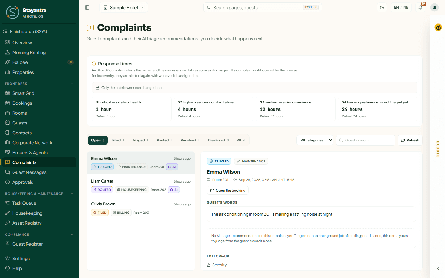 A complaint open: its status, category, room, the guest's words, and the note shown while no AI recommendation is attached