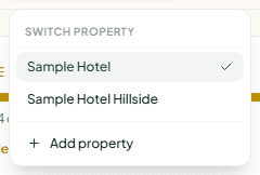 The property switcher open, listing two hotels and Add property