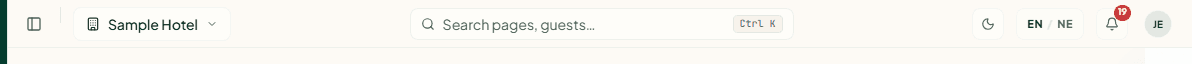The top bar with the property switcher, search, theme and language buttons, the notification bell and the account menu